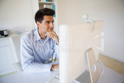 Casual businessman working at his desk