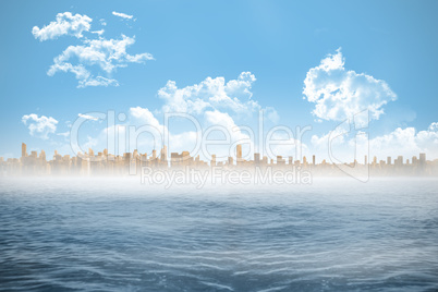 Cityscape on horizon over ocean