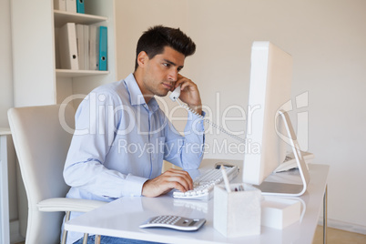 Casual businessman talking on the telephone