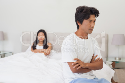 Couple not talking after argument in bed