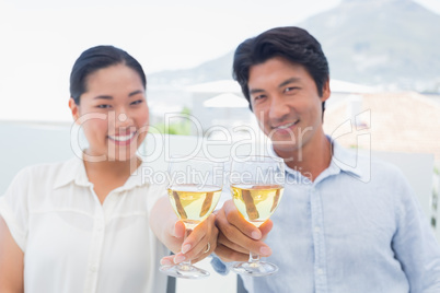 Happy couple having white wine