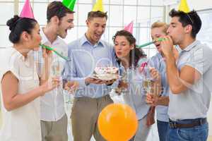 Casual businessmen team celebrating a birthday
