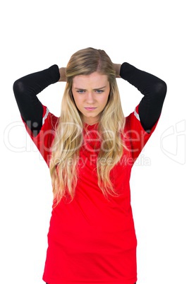 Disappointed football fan in red