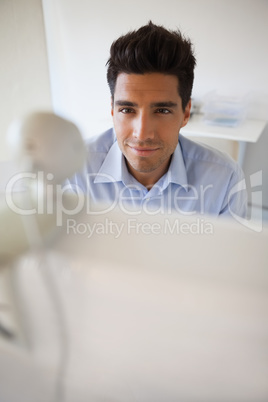 Casual businessman working at his desk