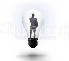 Thinking businessman in light bulb