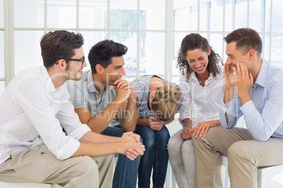 Group therapy in session sitting in a circle