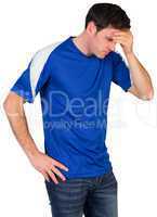 Disappointed football fan in blue