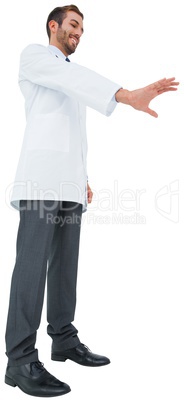 Handsome young doctor gesturing with hand