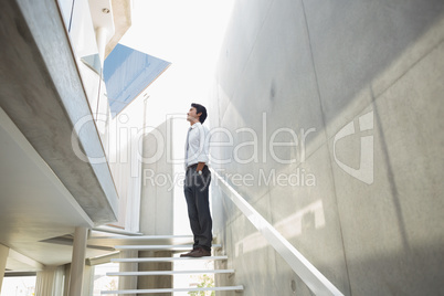 Man standing with hands in pockets