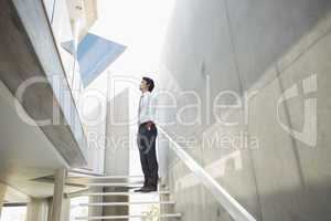 Man standing with hands in pockets