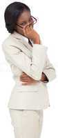 Thinking businesswoman in cream suit