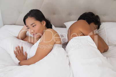 Couple not talking after argument in bed