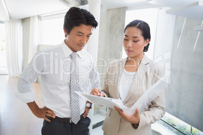 Estate agent showing lease to customer