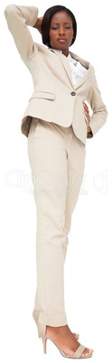 Thinking businesswoman in cream suit