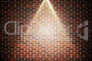 Red brick wall under spotlight