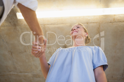 Casual business woman shaking hands with someone