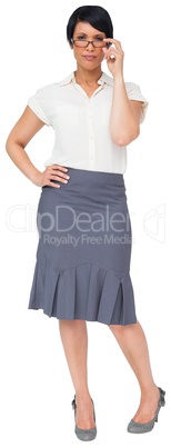 Thoughtful brown haired businesswoman in skirt