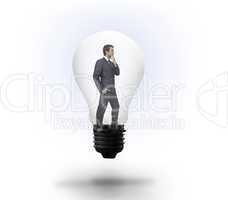 Thinking businessman in light bulb