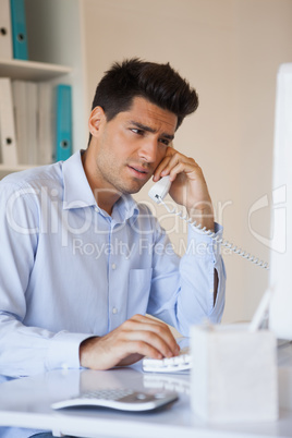 Casual businessman talking on the telephone