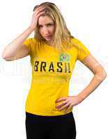 Disappointed football fan in brasil tshirt