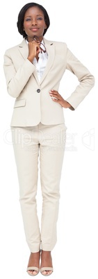 Thinking businesswoman in cream suit