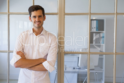 Casual businessman smiling at camera