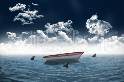 Sharks circling small boat in the sea