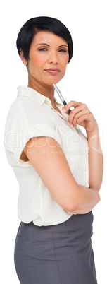 Thoughtful brown haired businesswoman in skirt