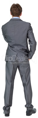 Thinking young businessman in grey suit