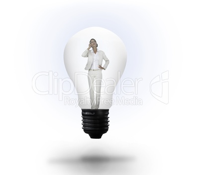 Thinking businesswoman in light bulb Thinking businesswoman in light bulb