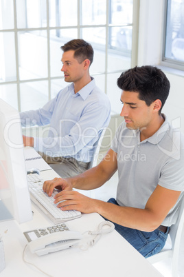 Casual businessmen working at desk