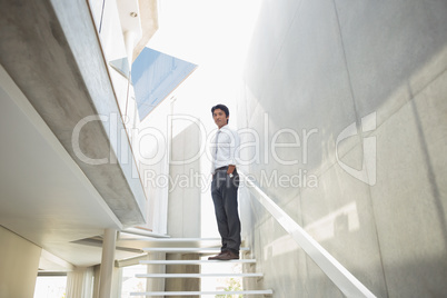 Man standing with hands in pockets