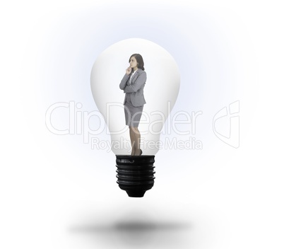 Thinking businesswoman in light bulb