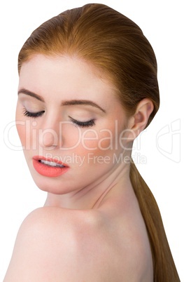 Beautiful redhead posing with eyes closed