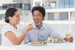 Happy couple having a meal together