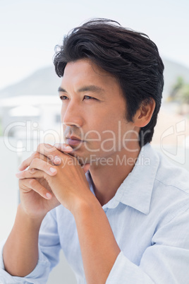 Thinking man with hands together