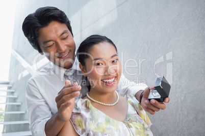 Man proposing marriage to his shocked girlfriend