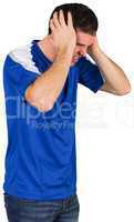 Disappointed football fan in blue