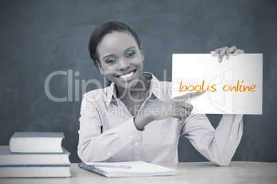 Happy teacher holding page showing books online