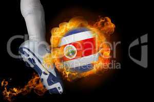 Football player kicking flaming costa rica ball