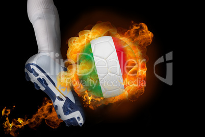 Football player kicking flaming italy ball