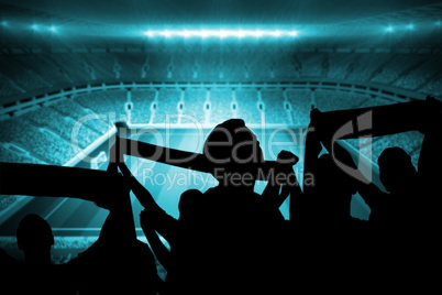 Silhouettes of football supporters