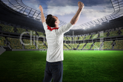 Excited football fan cheering