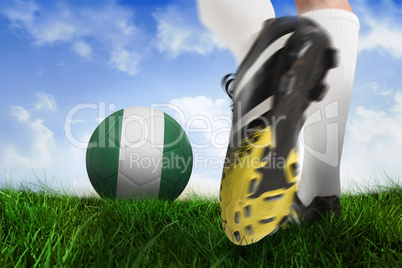 Football boot kicking nigeria ball