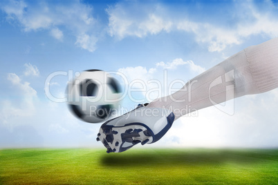 Close up of football player kicking ball