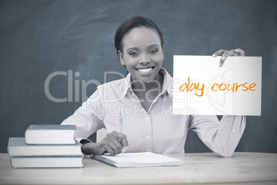 Happy teacher holding page showing day course