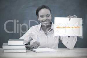 Happy teacher holding page showing extracurricular activities