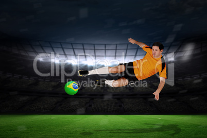 Football player in orange jumping