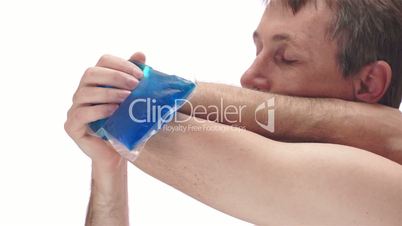 Man With Cold Pack on Elbow Side View