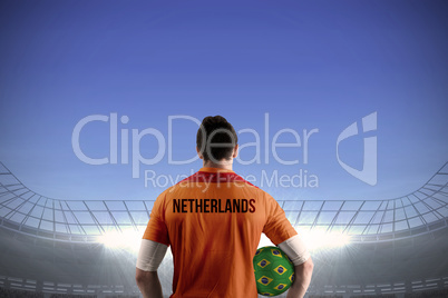Netherlands football player holding ball